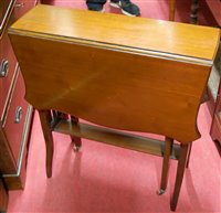 Lot 1209 - An Edwardian walnut Sutherland table