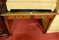 Lot 1217 - A joined oak and leather inset two drawer...