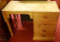 Lot 1229 - A modern pine campaign style desk, having four...