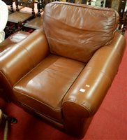 Lot 1278 - A contemporary tan leather upholstered club...