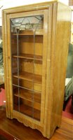 Lot 1284 - A 1930s limed oak single door lead glazed...