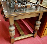Lot 1241 - A moulded oak drawleaf dining table, raised on...