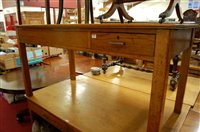 Lot 1248 - An early 20th century light oak single drawer...