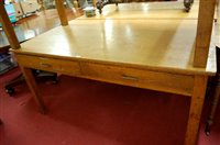 Lot 1249 - An early 20th century light oak two drawer...