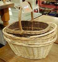 Lot 1261 - A pair of modern wicker twin handled baskets;...