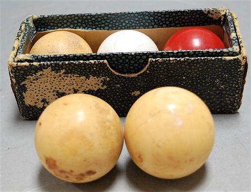 Lot 241 - Three Victorian ivory billiard balls together...