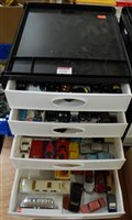 Lot 1456 - A five-tier plastic storage tray, containing a...