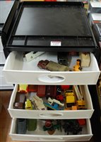 Lot 1457 - A five-tier plastic storage tray containing a...