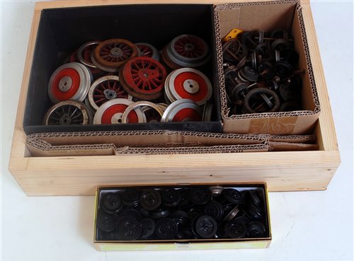 Lot 371 - A small wooden box of assorted wheels of...