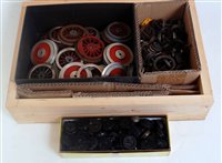 Lot 371 - A small wooden box of assorted wheels of...