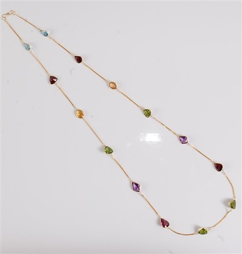 Lot 1183 - A multi gemset necklace, the mixed cut...