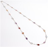 Lot 2614 - A mixed gemstone necklace, the oval faceted...