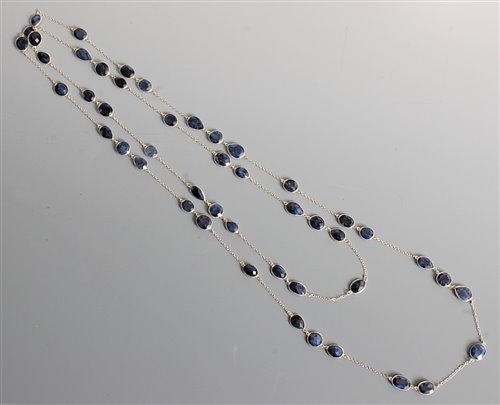 Lot 2669 - A long sapphire necklace, the mixed cut...