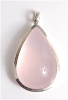 Lot 2666 - A large rose quartz and silver pendant, the...