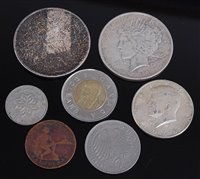Lot 2022 - A collection of 8 silver and other world coins,...