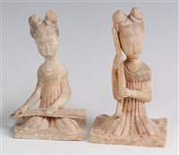 Lot 1306 - A pair of Chinese terracotta burial figures,...