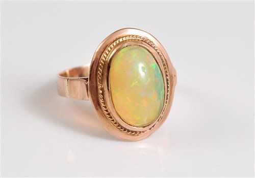 Lot 2628 - An opal ring, the oval cabochon approx. 12.8 x...