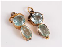 Lot 2657 - A pair of aquamarine earrings, the oval...
