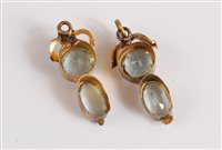 Lot 2657 - A pair of aquamarine earrings, the oval...
