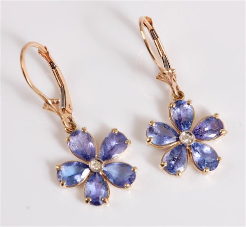 Lot 2670 - A pair of 14k tanzanite flowerhead earrings,...