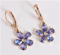 Lot 2670 - A pair of 14k tanzanite flowerhead earrings,...