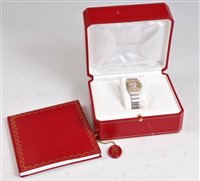 Lot 1223 - A lady's Cartier 18ct gold and steel Santos...