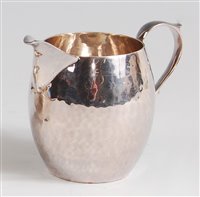 Lot 126 - An Art Deco silver cream jug, of all-over...
