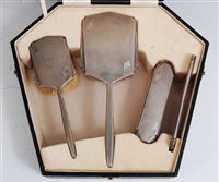 Lot 133 - An Art Deco engine turned silver four-piece...