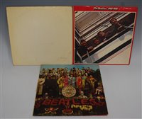 Lot 563 - Three vinyl LP records by The Beatles,...