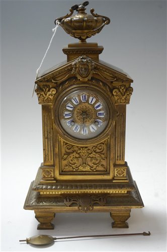 Lot 9 - A late 19th century brass cased mantel clock,...