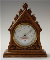 Lot 20 - A late Victorian carved oak cased barometer,...