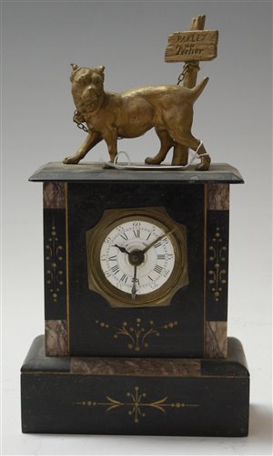 Lot 23 - A late 19th century black slate mantel clock,...