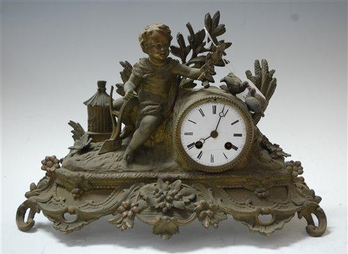 Lot 27 - A late 19th century spelter cased mantel clock,...
