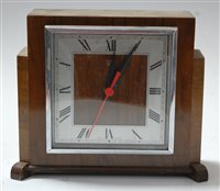 Lot 62 - A 1950s oak cased mantel clock, having...