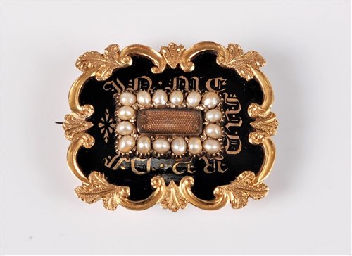 Lot 2599 - A 19th century memorial brooch, the central...