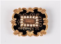 Lot 2599 - A 19th century memorial brooch, the central...