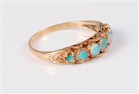 Lot 2654 - A 9ct seven stone opal ring, the seven...