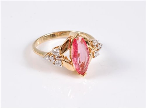 Lot 1184 - An 18ct padparadscha sapphire and diamond ring,...