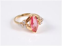 Lot 1184 - An 18ct padparadscha sapphire and diamond ring,...