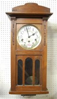Lot 99 - A 1930s oak cased wall clock having a silvered...