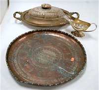 Lot 143 - A large eastern copper tray of circular form...