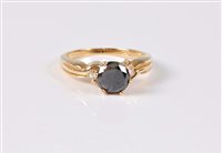 Lot 2577 - A black diamond and white hardstone ring, the...