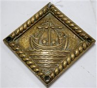 Lot 164 - A small brass plaque of square form, relief...