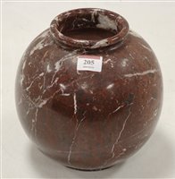 Lot 205 - A veined rouge marble vase, of globular form,...