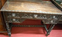 Lot 1241 - An early 20th century heavily carved oak...