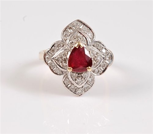 Lot 1186 - An 18ct ruby and diamond ring, the central...