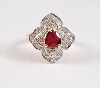 Lot 1186 - An 18ct ruby and diamond ring, the central...