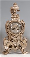 Lot 1511 - A Rococo Revival silvered bronze mantel clock,...