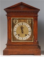 Lot 1519 - A circa 1900 German oak cased bracket clock,...