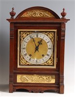 Lot 1520 - A circa 1900 oak cased mantel clock, the...